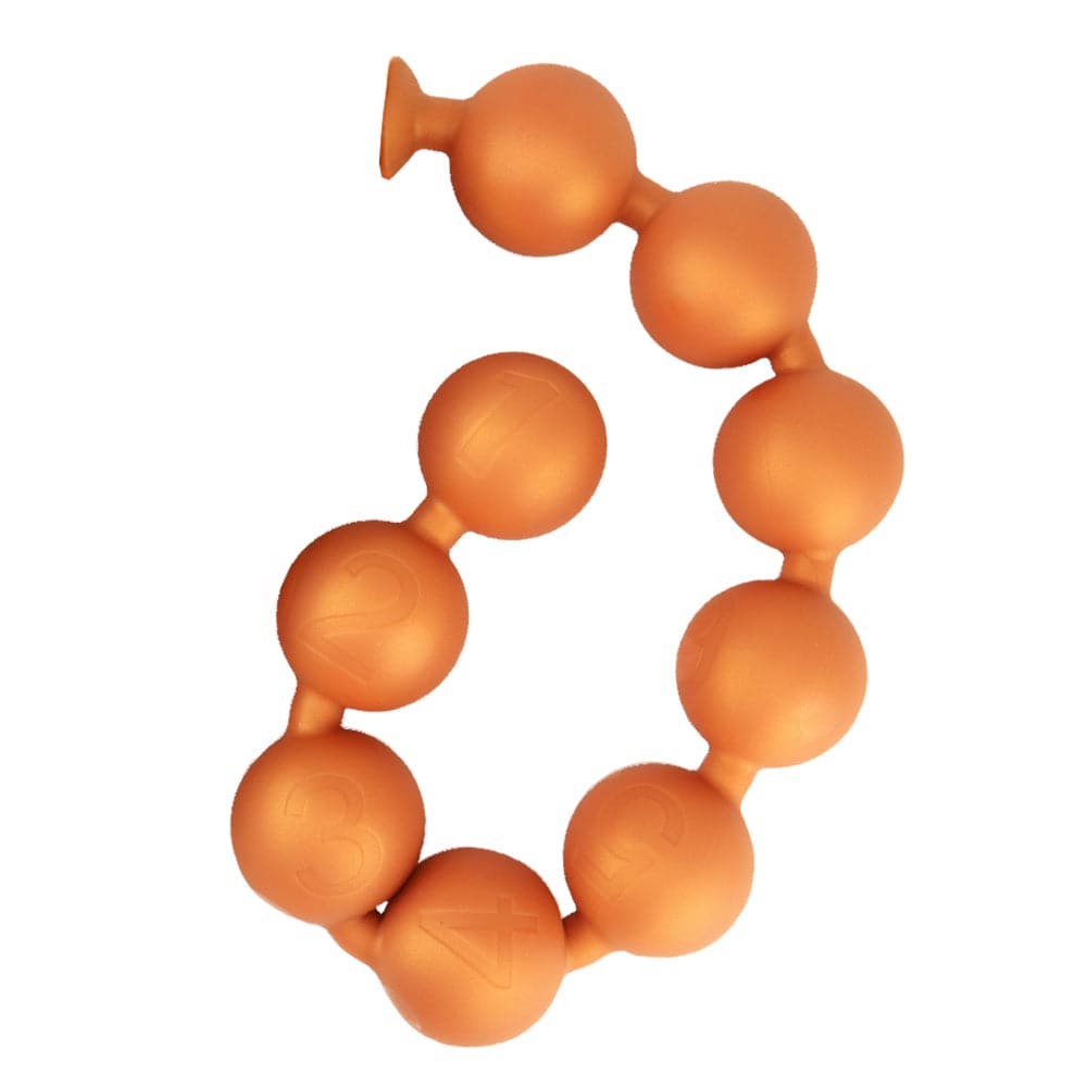 25 inch extra long deep training huge anal bead gold on white background.
